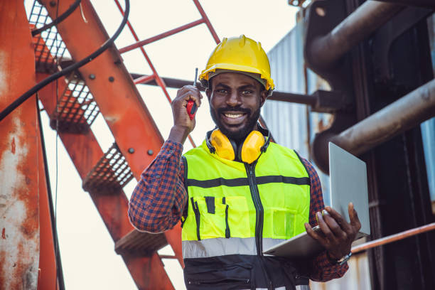 istock black worker African working engineer foreman radio control in port cargo shipping customs container yard 1449766326