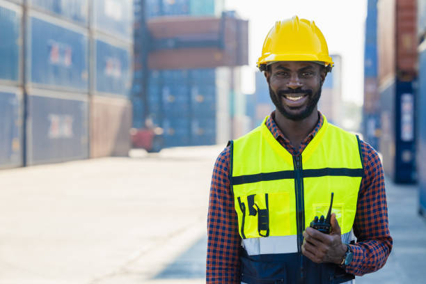 istock black worker African working engineer foreman radio control in port cargo shipping customs container yard 1449766341