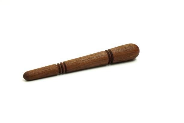 istock The image shows a handcrafted portable acupressure stick device made of solid wood on a white background, isolated. 1449768490