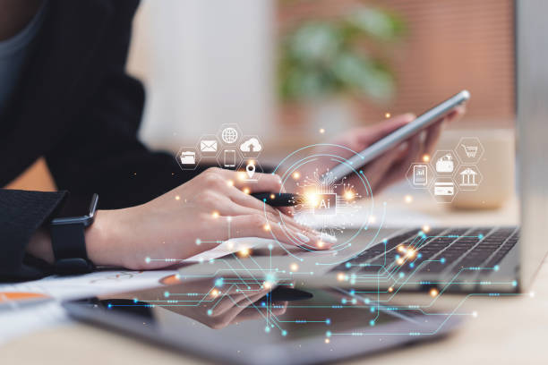 istock Close up hands of business person using phone and laptop for cloud computing technology with online internet network 1449768503