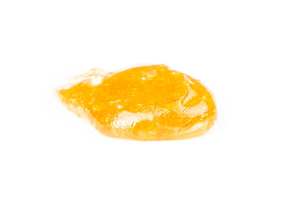 istock gold cannabis resin extract isolate on white background,yellow dab smear 1449768609