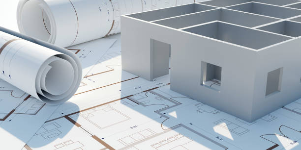 Architecture design drawings, building model on blueprint floor plan, house construction. 3d stock photo