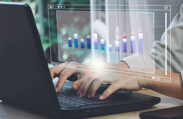 istock Women hand using computer working is showing a growing virtual hologram stock, invest in trading. Data science for business analytics. Infographics on futuristic virtual interface screen. 1449772328