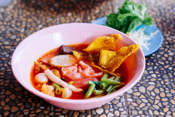 istock Close up of noodle in pink broth ( Yentafo ) 1449772402
