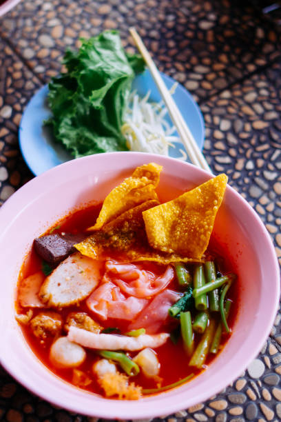 istock Close up of noodle in pink broth ( Yentafo ) 1449772430