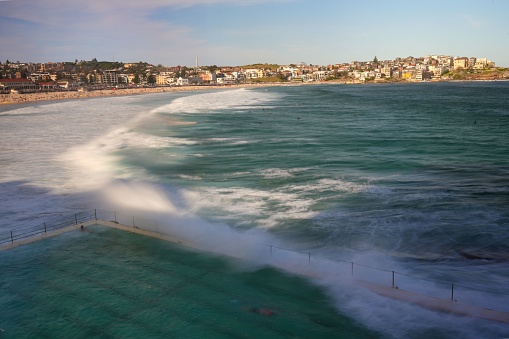 Scenic view of Bondi beach with foamy waves in the background, Sydney, New South Wales, Australia