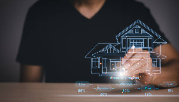 istock Engineering and architecture drawings and mini home model concept, Engineer man writing of architect starting draw a house blueprint on the desk in the home office, work from home, Real estate offer 1449779121