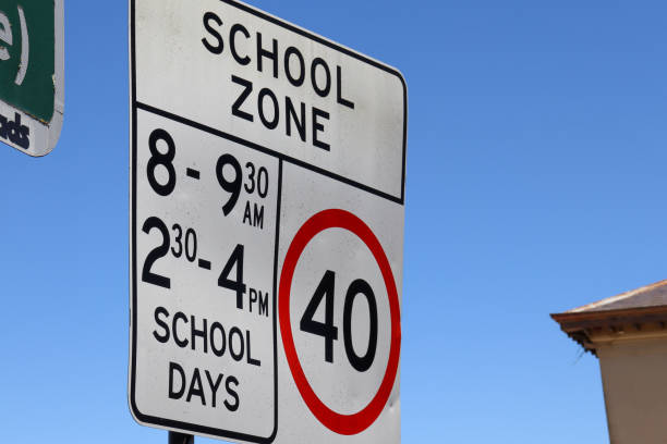 istock school zone sign against sky 1449779816