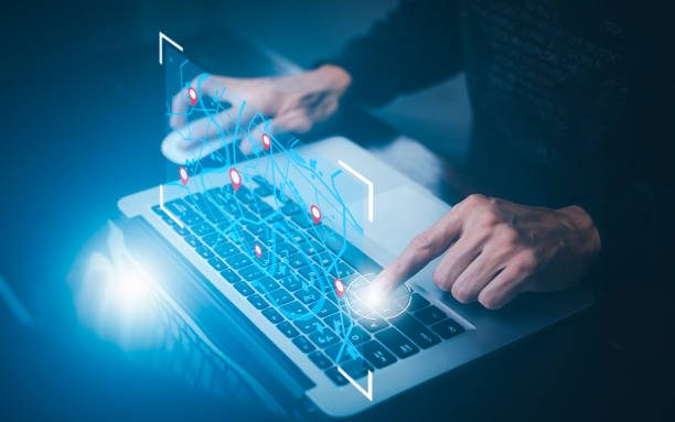 istock Man using laptop with virtual world and model map with location point , GPS app, icon Travel maps and find places in the online system, all screen graphics are generated,Searching for travel. 1449779990