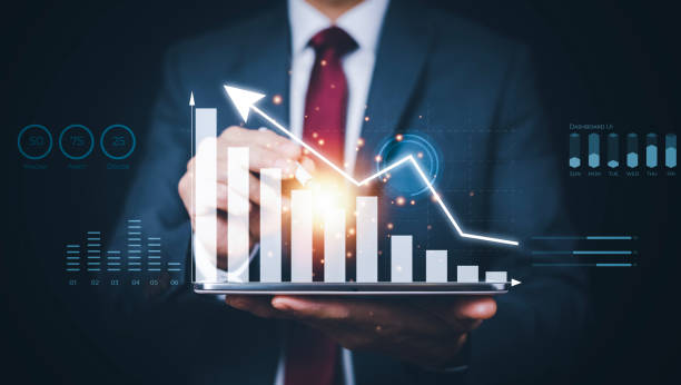 istock Businessman holding tablet bar graph of analytics and financial, Changes in new planning, Business growth, ideas and perspectives, Stock investment, and dividends yield from business in the new year 1449780007