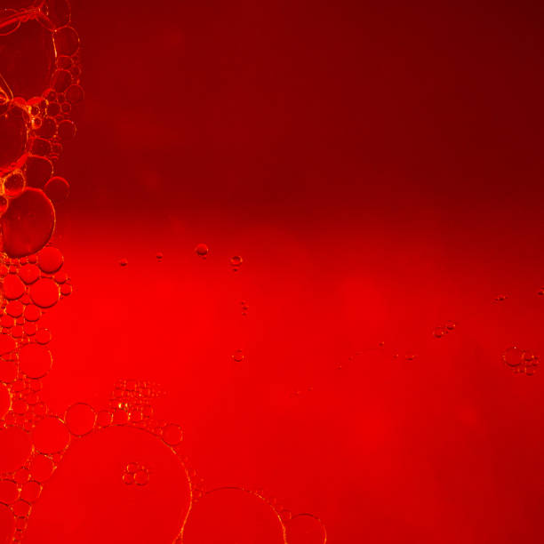 istock Red background decorated with abstract soap bubbles of different sizes, small and large, and shapes 1449780280