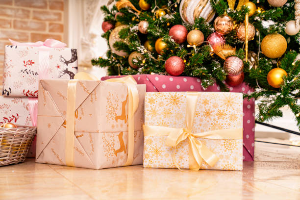 istock boxes with gifts on the Christmas tree with classic decorations. 1449781714