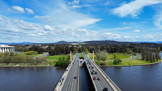 Aerial view of Commonwealth avenue and bridge over Burley Griffin lake in Canberra, Australia
