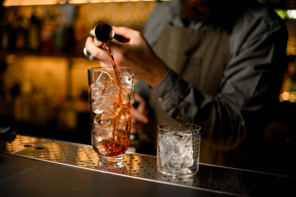 istock transparent glass with ice cube and mixing cup with ice on bar 1449783156