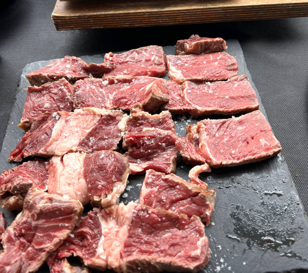 Beef, cooking on a hot stone, Adamuz, Spain stock photo