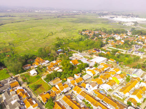 istock Aerial housing flanked by agricultural fields 1449788228