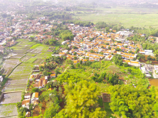 istock Aerial housing flanked by agricultural fields 1449788273