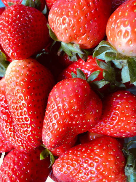 istock Fresh strawberry fruit background top view closeup 1449791306
