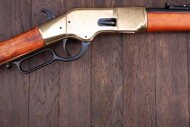 istock Old west gun. Lever-action repeating rifle. 1449796122