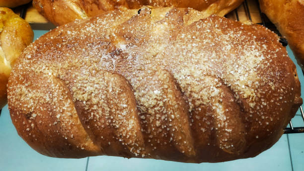 istock Fresh from the oven brown bread with sugar sprinkles topping. 1449796464