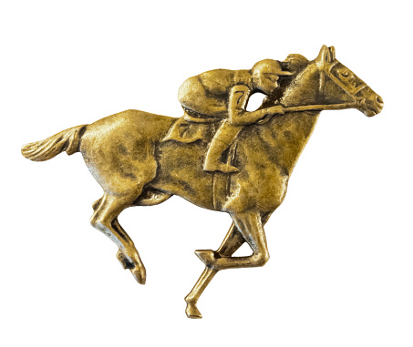 Old bas relief, metal horse racing badge cut out on a white background, with clipping path. Saddlecloth with the Number Seve - Lucky 7
