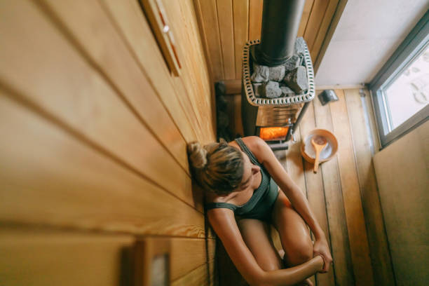 Group of multiracial friends relaxing in the sauna