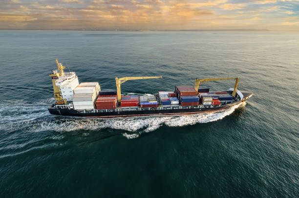 istock Nice aerial view of a container ship sailing at dawn 1449802948