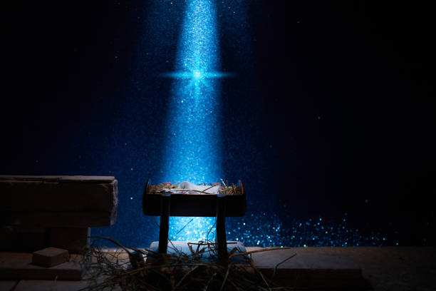 istock Nativity of Jesus, empty manger at night with bright lights. 1449804286