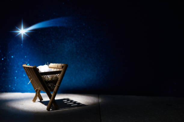 istock Nativity of Jesus, empty manger at night with bright lights. 1449804314