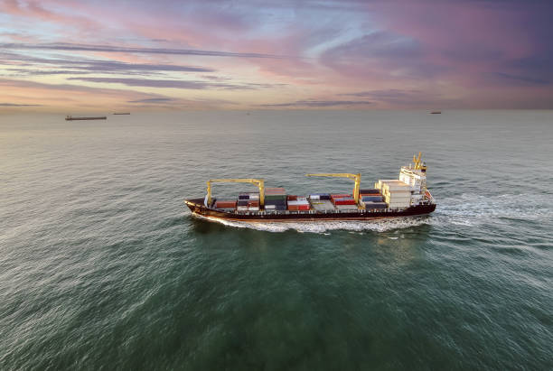 istock Nice aerial view of a container ship sailing at dawn 1449804375