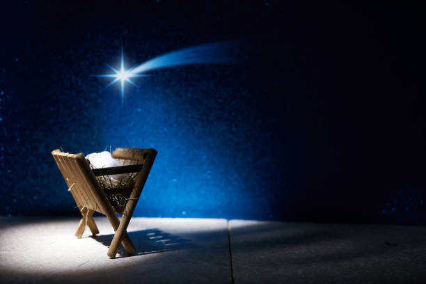 istock Nativity of Jesus, empty manger at night with bright lights. 1449804558