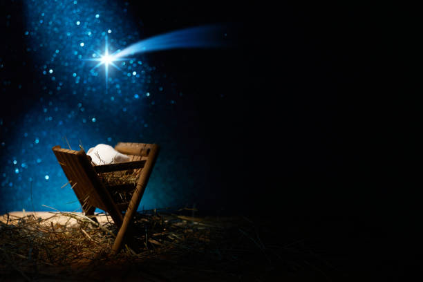 istock Nativity of Jesus, empty manger at night with bright lights. 1449804581