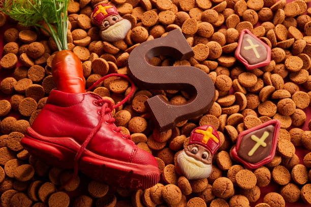 istock Saint Nicholas - Sinterklaas day with shoe, carrot and traditional sweets 1449804595