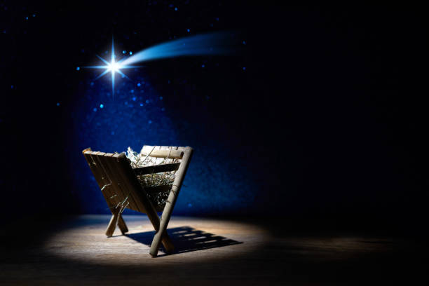istock Nativity of Jesus, empty manger at night with bright lights. 1449804796