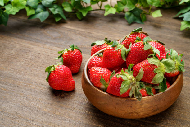 istock Fresh strawberry fruits on wooden table 1449804962