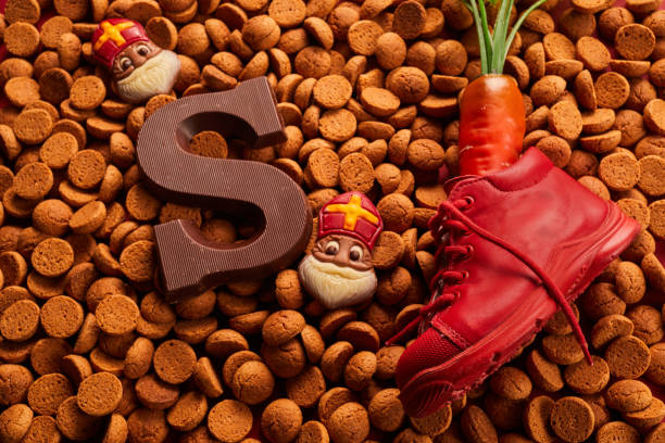 istock Saint Nicholas - Sinterklaas day with shoe, carrot and traditional sweets 1449805510
