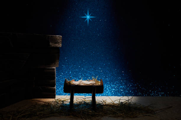 istock Nativity of Jesus, empty manger at night with bright lights. 1449805640