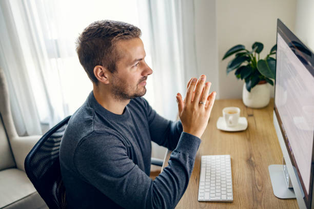 istock A focused content writer is checking on text and looking at the monitor while working from home office. 1449805809