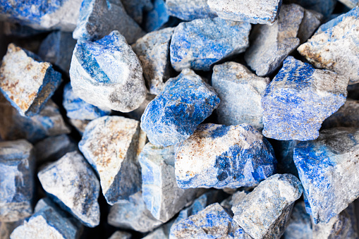 Closeup of various colorful stones quartz, marbles, ore minerals, gems use as ornament and decoration jewelry that contain spiritual force human believes