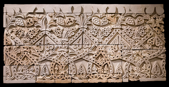 CORDOBA. SPAIN. - October 27, 2015:  Friso de atauriques. Archaeological remains of an ancient decorated frieze, Caliphate era, late 10th century. Archaeological and Ethnological Museum of Cordoba.