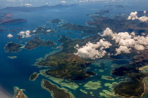 A bird's eye view of El Nido with white clouds in the sky