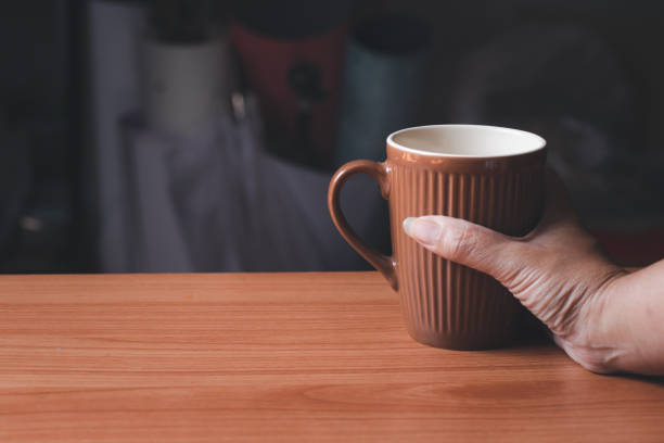 istock Hand holding a cup of coffee.Copy space 1449821371