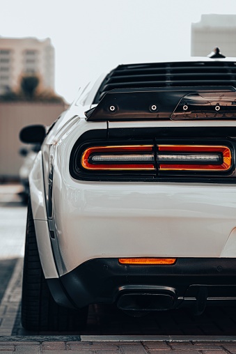 Dubai, United Arab Emirates – September 17, 2022: A vertical rear view of a Dodge Hellcat supercar with orange breaks