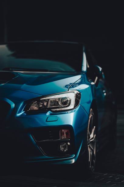 25 February 2025, Chiba, Japan. A sports car is driving the city streets at night with blurred motion, showing speed.