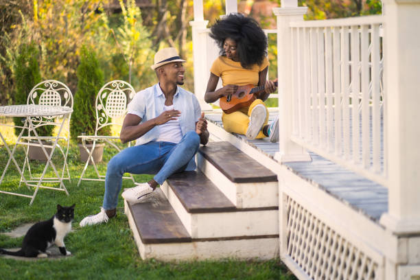 Couple relaxing on porch steps