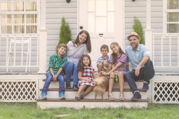 istock A smiling family sitting on porch steps 1449823823