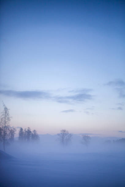 Beautiful foggy sunset in winter wonderland Finland