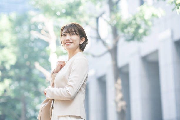 istock Business woman smiling in the city 1449827708