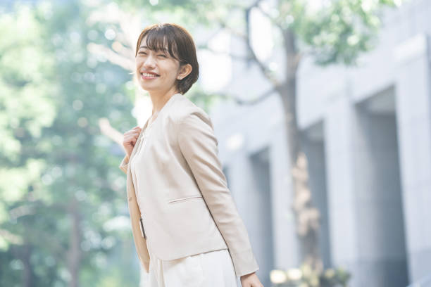Business woman smiling in the city stock photo