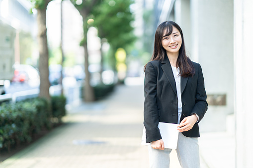 https://media.istockphoto.com/id/1449828144/photo/business-woman-smiling-in-the-city.jpg?b=1&s=170667a&w=0&k=20&c=PBIksbxnT9cmXmfINYY0TBNITAIdytAjKqu84ewcabA=